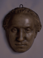 Plaster mask of face of George Washington with open eyes and carved irises.