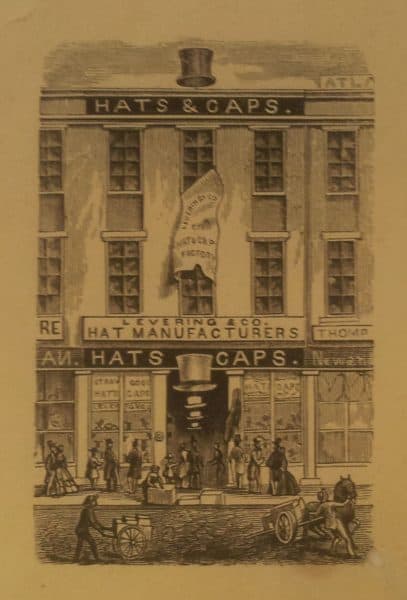 Print depicting a busy storefront.