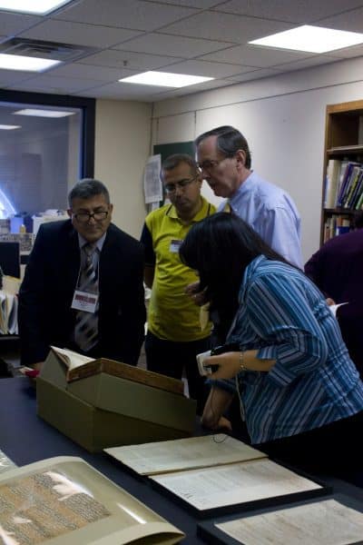 Delegtion of Iraqi librarians viewing collections in the Print Department.