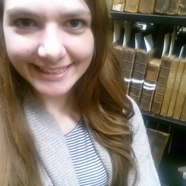 Kayla Hohenstein in front of Hatboro book collection