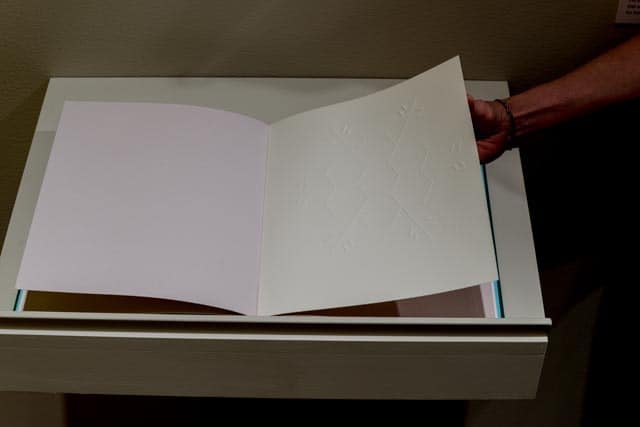 Teresa Jaynes, Gift #7, 2016. Book with embossed paper. Photo by Gary McKinnis.
