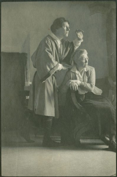 Jessie Willcox Smith seated in front of an unidentified man in costume was clearly used as a study for one of Elizabeth Shippen Green’s illustrations. Featured in Tales from Shakespeare by Charles and Mary Lamb (1922), the image is titled “Do You See Nothing There? Nothing at All, Yet All That I See” and is found within the “Hamlet, Prince of Denmark” chapter.