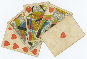 A hand of playing cards laid out on a white background. 