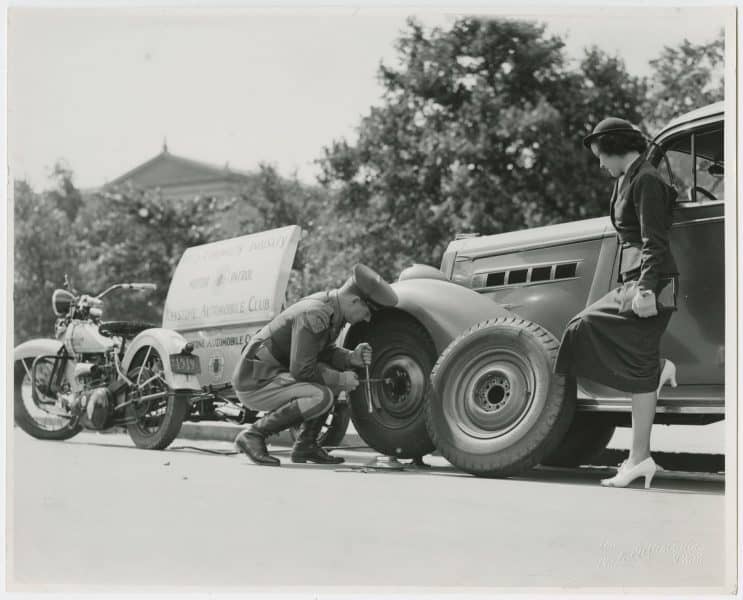 The Photo-Illustrators. Keystone Automobile Club Motor Patrol Changing a Tire, gelatin silver photograph, ca. 1937. The Library Company of Philadelphia. Gift of Joseph Kelly.