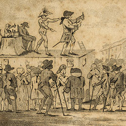 Three men and monkey on roof of shed. One in costume points to crowd on ground. Large building with clock and columns in background.