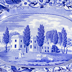 Sheep, people, and dog in foreground of large residence located in tree grove. Image is on flat bottom of platter