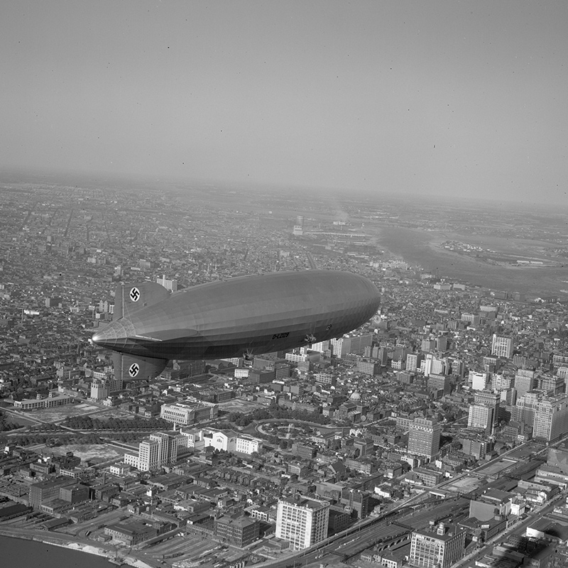 Aerial view of zeppelin over Philadelphia near Market Street and the Schuylkill River.