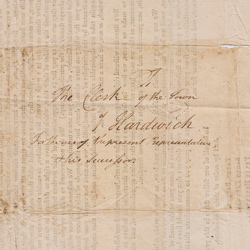 The backside of a printed letter, showing cursive notes