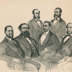 An image of seven Black men wearing suits