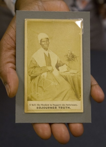 Jasmine Smith, LCP African American history subject specialist, holds a rare trading card type photo of abolitionist speaker Sojourner Truth.