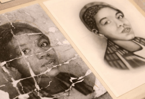 A photo of an unidentified young African American woman is deeply creased as if it were folded and carried around by someone who valued it. It is part of an exhibit at the Library Company of Philadelphia called "Negro Pasts and Afro-futures." (Emma Lee/WHYY)