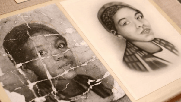 A photo of an unidentified young African American woman is deeply creased as if it were folded and carried around by someone who valued it. It is part of an exhibit at the Library Company of Philadelphia called "Negro Pasts and Afro-futures." (Emma Lee/WHYY)