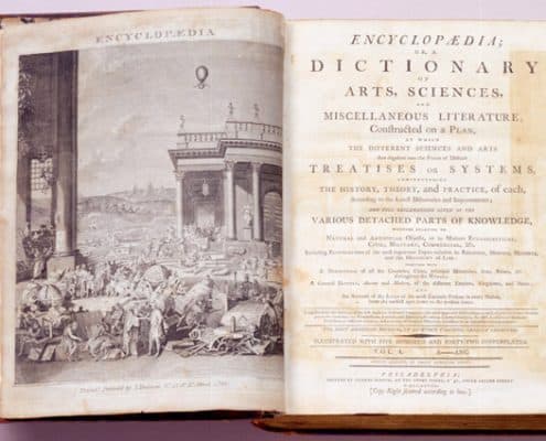 Open book. Crowded outdoor scene and classical-style architecture on left. Title page on right.