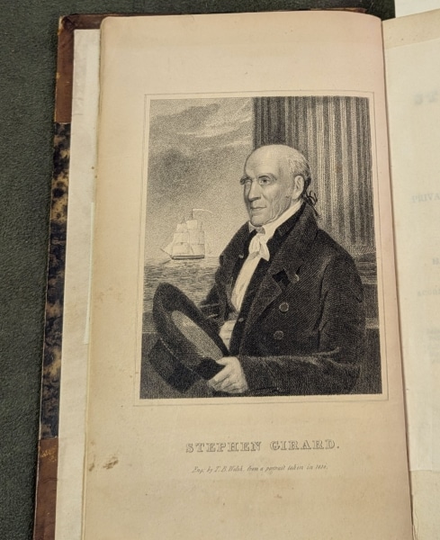 Photograph of open book showing frontispiece portrait of Stephen Girard