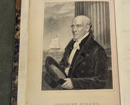 Photograph of open book showing frontispiece portrait of Stephen Girard