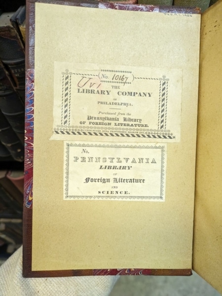 Photograph of inside cover of book with two bookplates