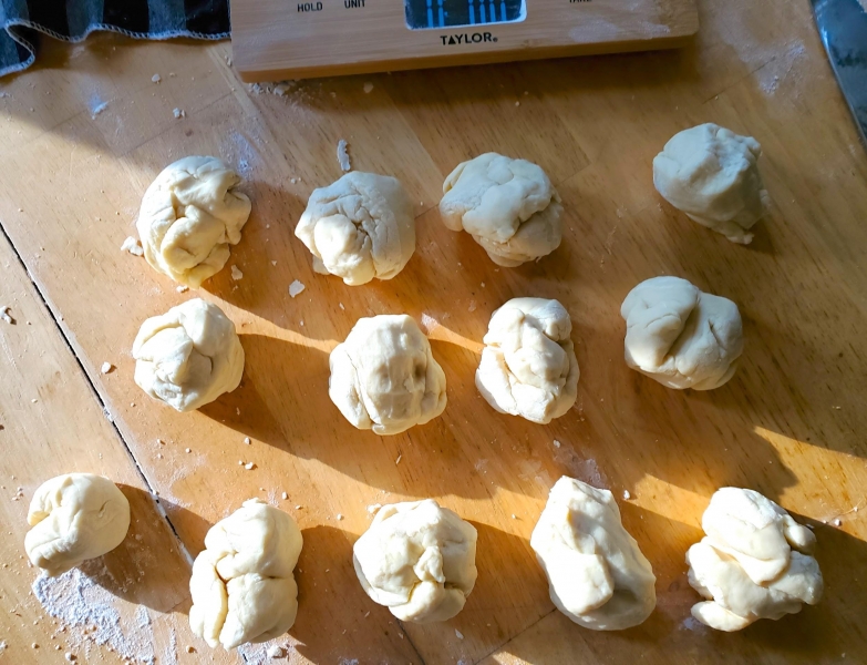Image of the weighed balls of dough with the excess dough.
