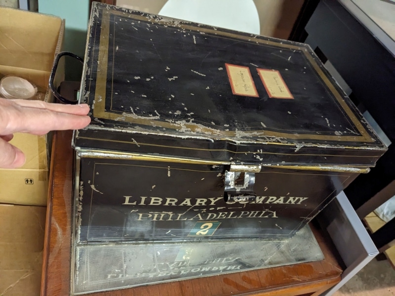 Photograph of black metal box used for storing documents