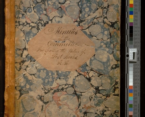 Photograph of cover of bound volume titled Minutes of the Committee for Fixing the Value of Lost Books