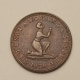 Photograph of medal with woman kneeling with raised arms in chains and text that reads Am I Not a Woman and a Sister 1838