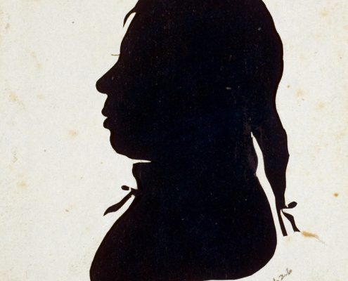 19th-century silhouette of Black man artist Moses Williams facing left wearing bows on ponytail and collar.