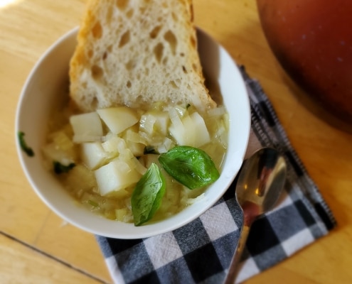 Leek Soup served with fresh crusty bread and basil.