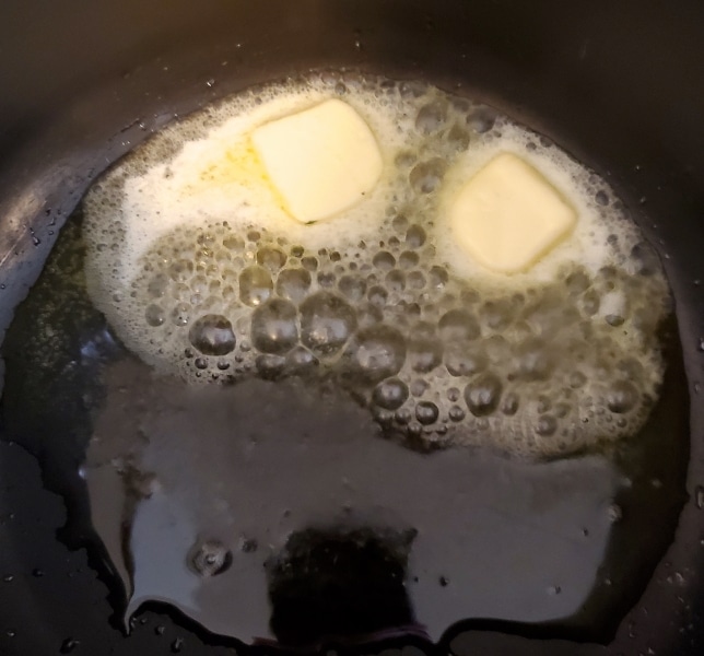 Butter and oil heating in a pot.