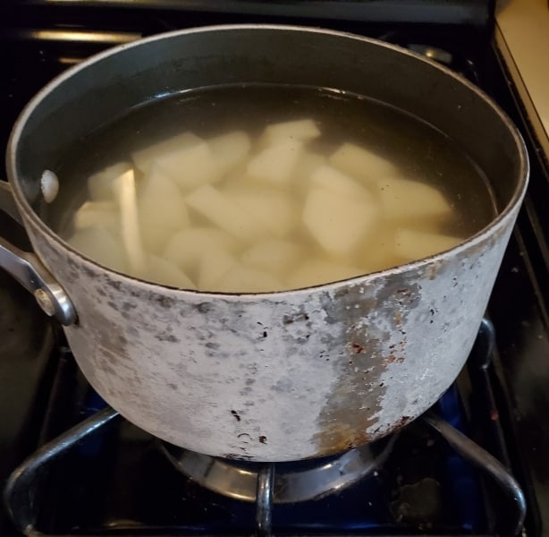 Cooking the potatoes for the pie filling
