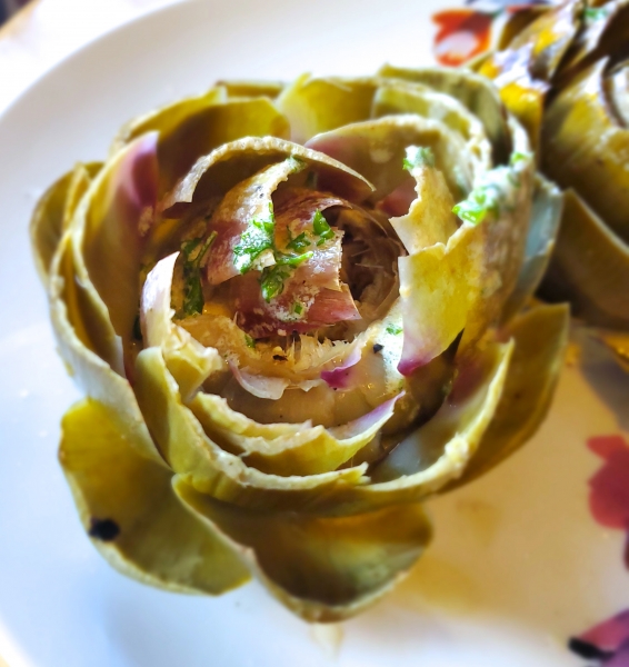 Finished artichoke, seasoned and filled with cream sauce