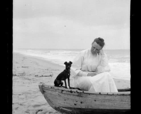 Woman and dog in boat, Sea Girt Marriott C. Morris Collection [P.2013.13.142]