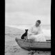 Woman and dog in boat, Sea Girt Marriott C. Morris Collection [P.2013.13.142]