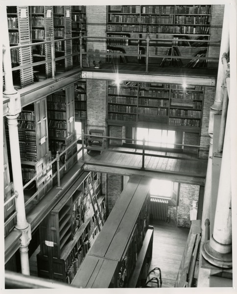 Shelving possibly built by janitor Edward McGrath in the book stacks at the Ridgway Building, ca. 1950s. Gelatin silver print.