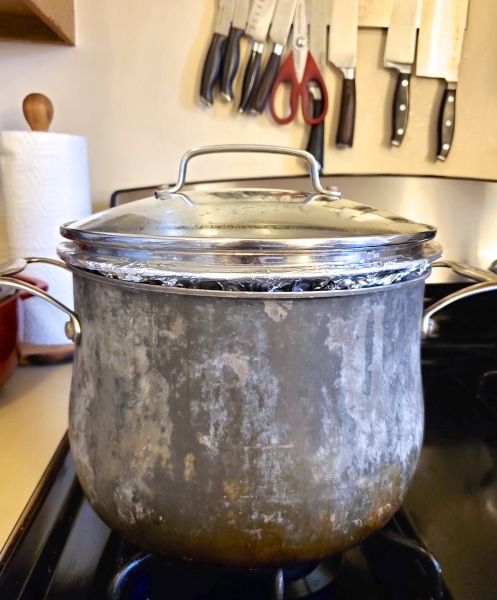 Boiling the pudding in a stock pot