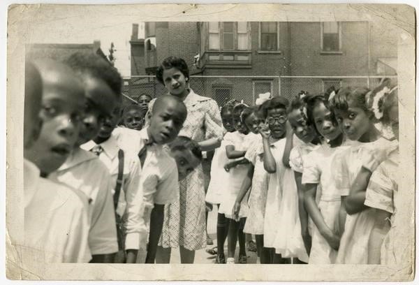 [Mary Venning with her students in Philadelphia school yard], ca. 1945. Gelatin silver print.